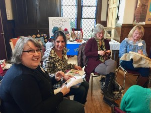 Sisters Tammy and Teresa cross-stitching.