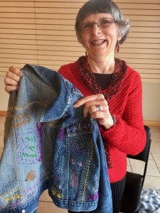 Grace is continuing to embroider on her jean jacket.